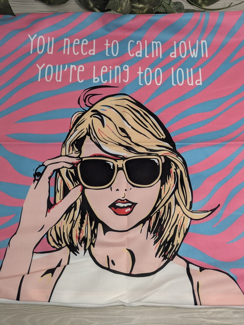 Taylor Swift-themed pillow cover featuring pop art lyrics from "You Need To Calm